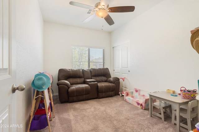 recreation room with carpet and ceiling fan