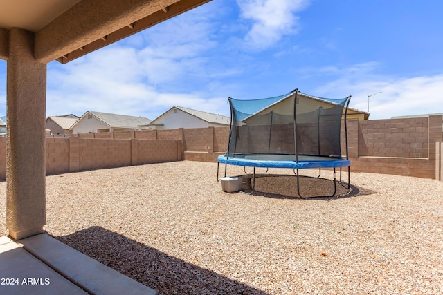 view of yard featuring a trampoline