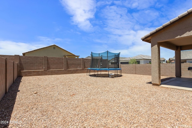 view of yard featuring a trampoline