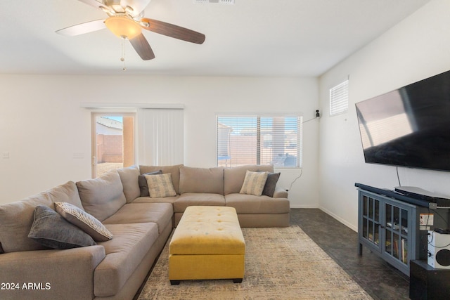 living room with plenty of natural light and ceiling fan