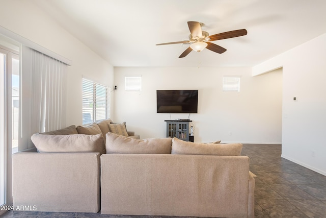 tiled living room featuring ceiling fan