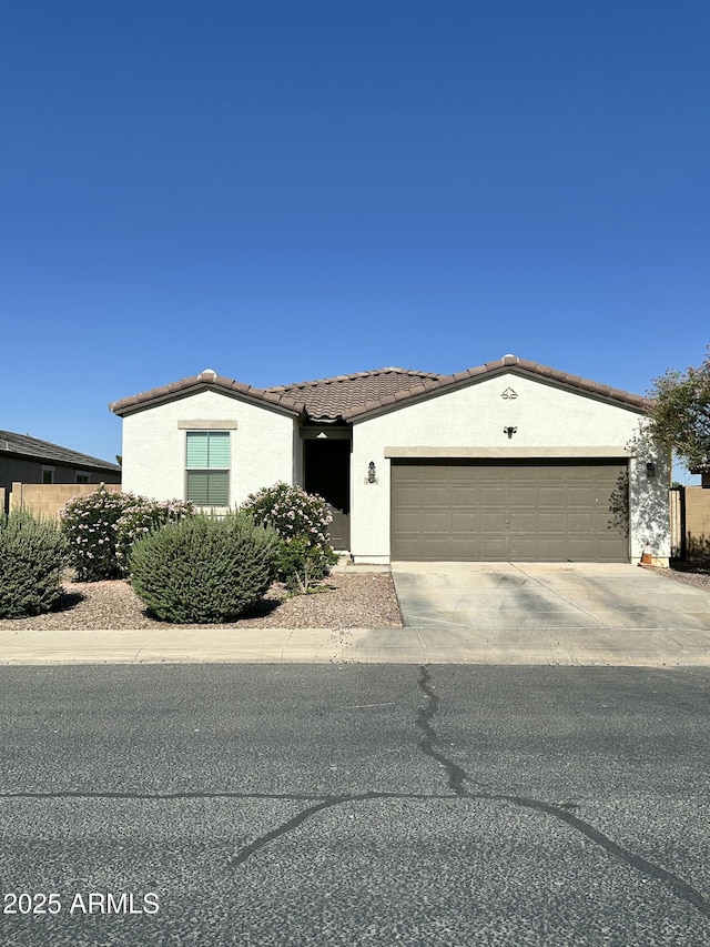 724 S 11th St, Coolidge, AZ 85128 - single story home featuring an attached garage, a tile roof, stucco siding, and driveway