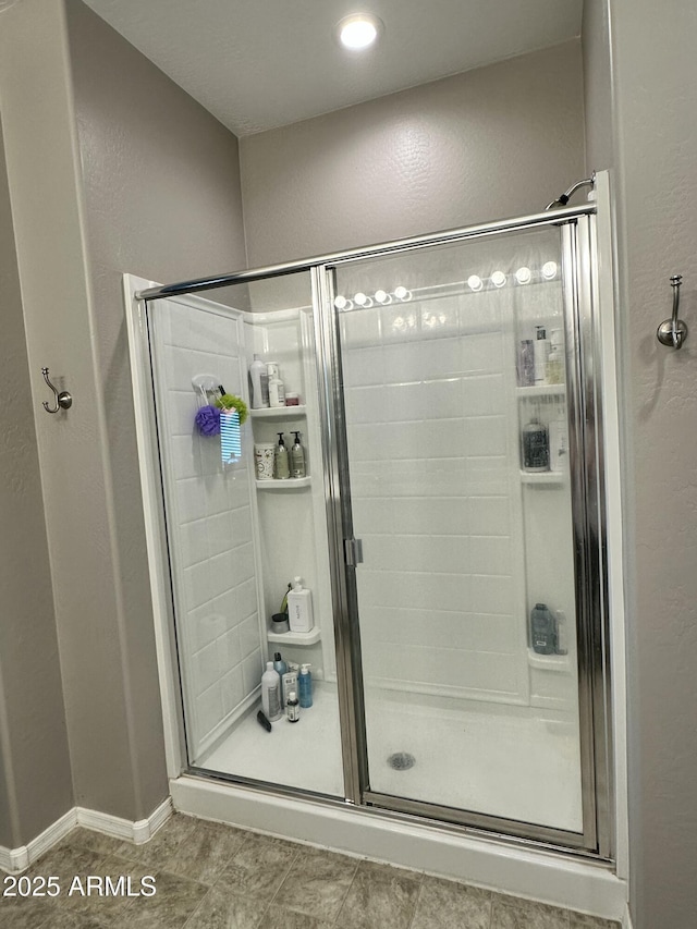 724 S 11th St, Coolidge, AZ 85128 - bathroom with a stall shower and a textured wall