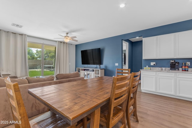 724 S 11th St, Coolidge, AZ 85128 - dining room with light wood finished floors and a ceiling fan