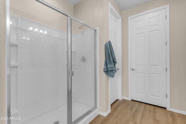 724 S 11th St, Coolidge, AZ 85128 - bathroom with a stall shower and wood finished floors