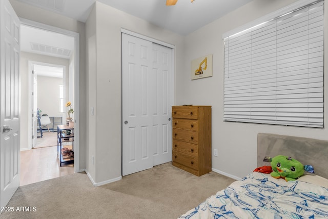 724 S 11th St, Coolidge, AZ 85128 - bedroom with light colored carpet, a closet, and a ceiling fan