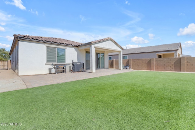 724 S 11th St, Coolidge, AZ 85128 - rear view of property with a fenced backyard, a patio area, a tile roof, and stucco siding