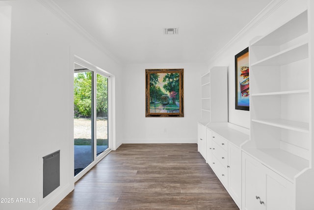 2607 E Mercer Ln, Phoenix, AZ 85028 - unfurnished dining area featuring dark wood-style floors and crown molding