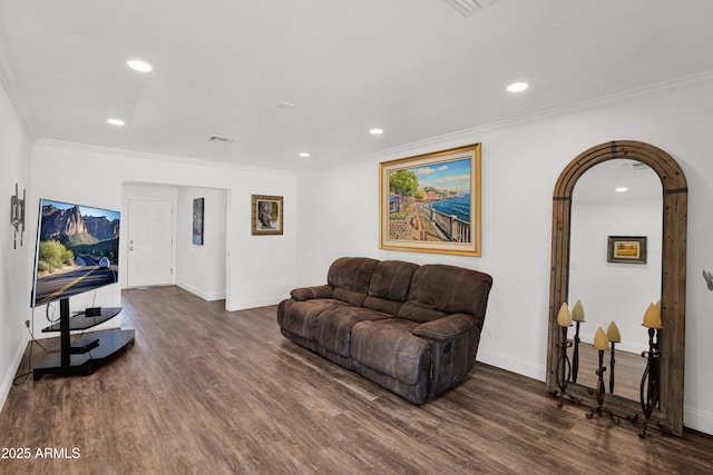 2607 E Mercer Ln, Phoenix, AZ 85028 - living area featuring dark wood-style flooring, recessed lighting, ornamental molding, and arched walkways