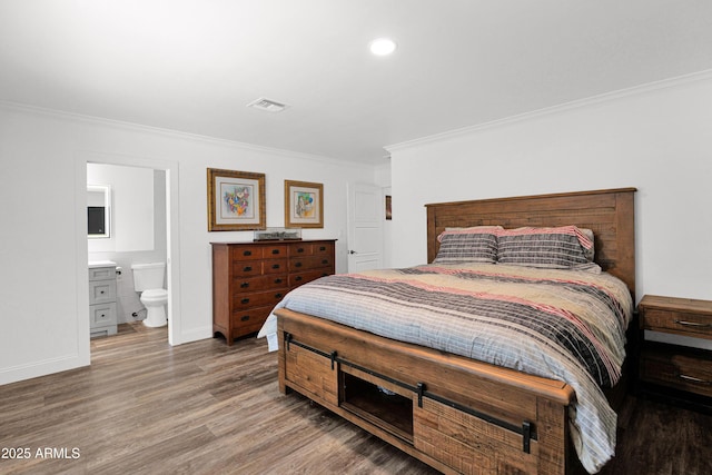2607 E Mercer Ln, Phoenix, AZ 85028 - bedroom featuring crown molding, wood finished floors, ensuite bath, and recessed lighting