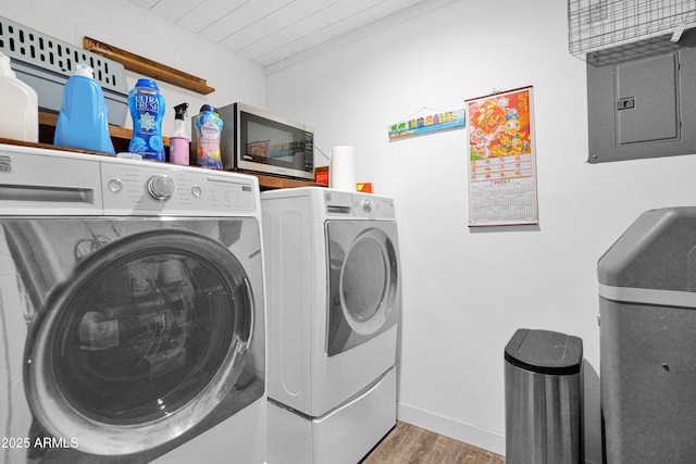 2607 E Mercer Ln, Phoenix, AZ 85028 - laundry area with electric panel, washing machine and clothes dryer, and wood finished floors