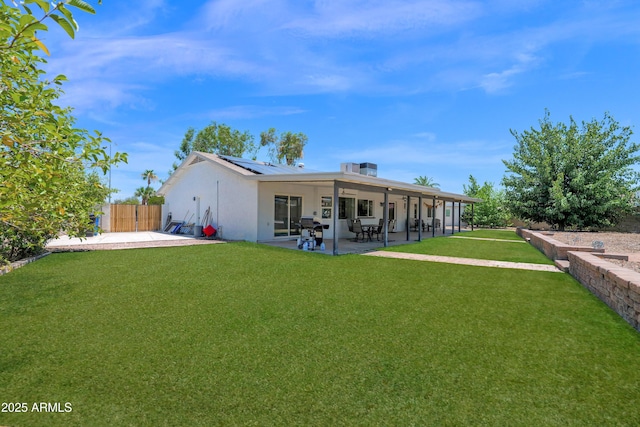 2607 E Mercer Ln, Phoenix, AZ 85028 - rear view of property featuring roof mounted solar panels, a patio, and stucco siding