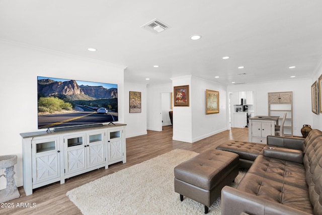 2607 E Mercer Ln, Phoenix, AZ 85028 - living room featuring recessed lighting, wood finished floors, and ornamental molding