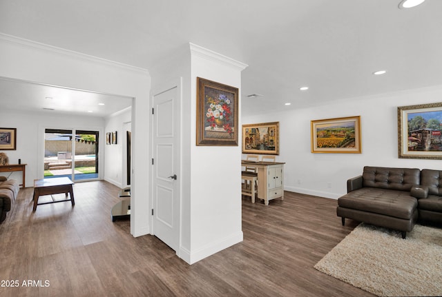 2607 E Mercer Ln, Phoenix, AZ 85028 - living room with crown molding, wood finished floors, and recessed lighting