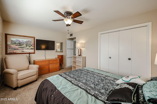 bedroom with ceiling fan, a closet, and light colored carpet