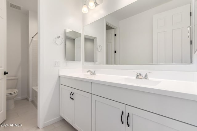 full bathroom featuring tile patterned flooring, vanity, shower / bathtub combination, and toilet