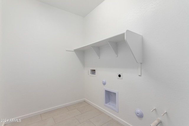 laundry room featuring gas dryer hookup, light tile patterned floors, washer hookup, and hookup for an electric dryer