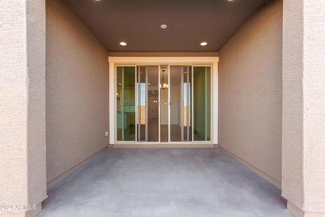 property entrance featuring a patio