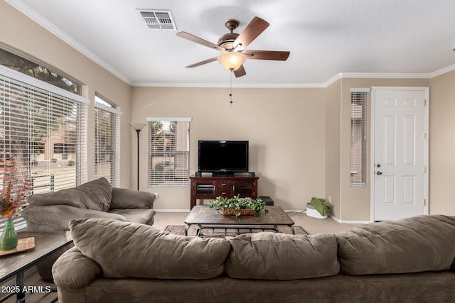 living room with crown molding, light colored carpet, and ceiling fan