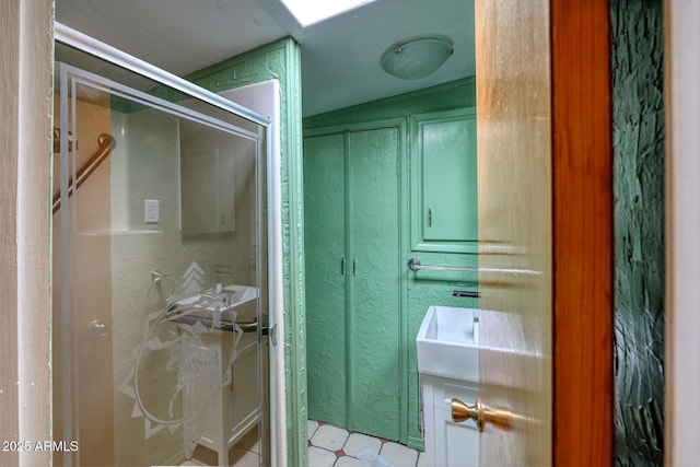 full bathroom with a shower with shower door