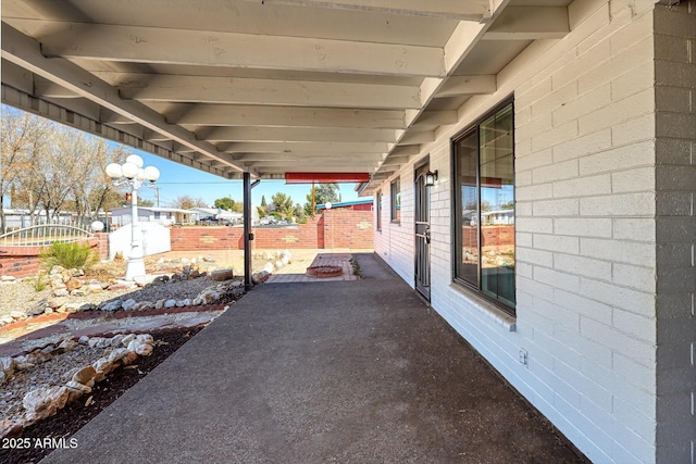 view of patio featuring fence