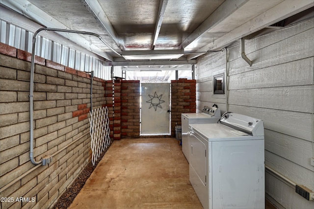 laundry room featuring washing machine and clothes dryer