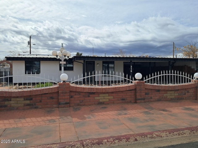 view of front of home with fence