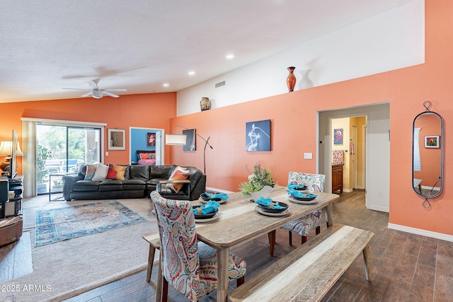 dining space featuring dark wood-style floors, recessed lighting, visible vents, vaulted ceiling, and baseboards