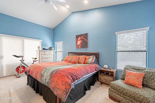 carpeted bedroom with vaulted ceiling and ceiling fan