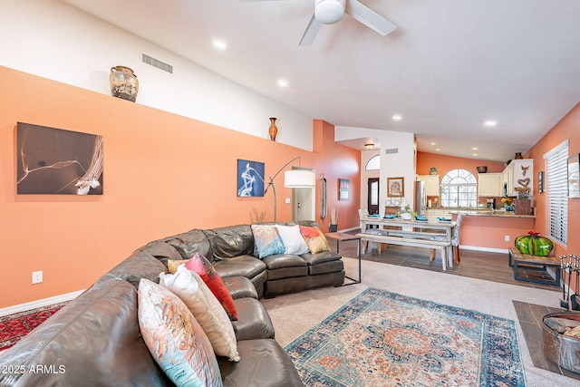 living room featuring visible vents, vaulted ceiling, a ceiling fan, and recessed lighting