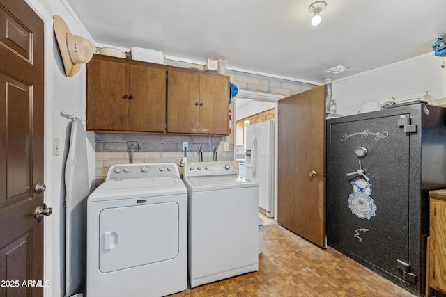 laundry room featuring washer and dryer and cabinet space