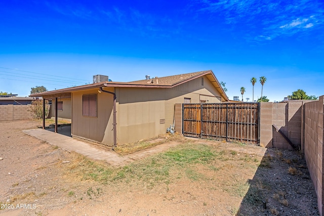 view of property exterior with a fenced backyard