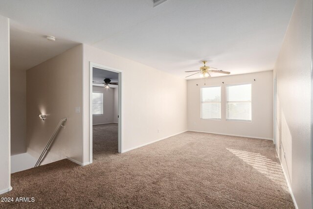 8143 E Obispo Ave, Mesa, AZ 85212 - spare room featuring carpet floors, ceiling fan, and plenty of natural light