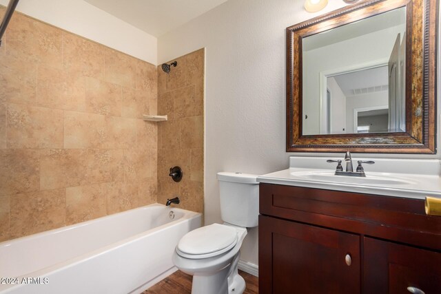 8143 E Obispo Ave, Mesa, AZ 85212 - bathroom featuring toilet, vanity, wood finished floors, and shower / washtub combination