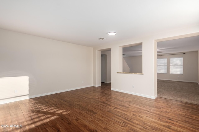 8143 E Obispo Ave, Mesa, AZ 85212 - unfurnished room with baseboards and dark wood-style floors