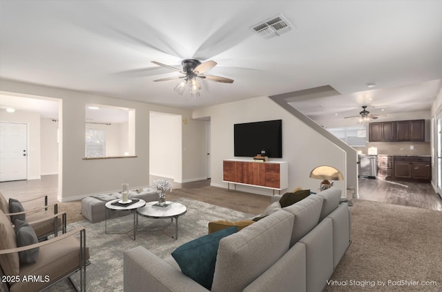 8143 E Obispo Ave, Mesa, AZ 85212 - carpeted living area with a ceiling fan and baseboards