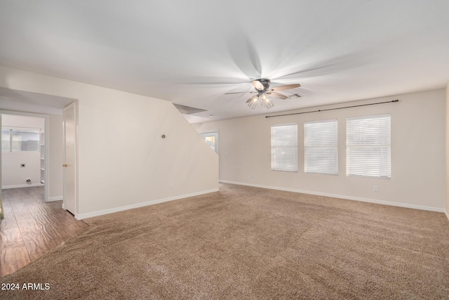 8143 E Obispo Ave, Mesa, AZ 85212 - unfurnished living room with ceiling fan, light colored carpet, and baseboards