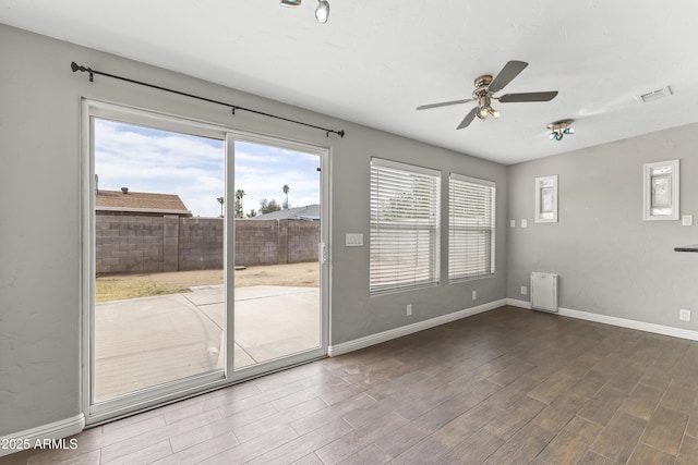 2633 E Garnet Ave, Mesa, AZ 85204 - empty room featuring a ceiling fan, wood finished floors, and baseboards