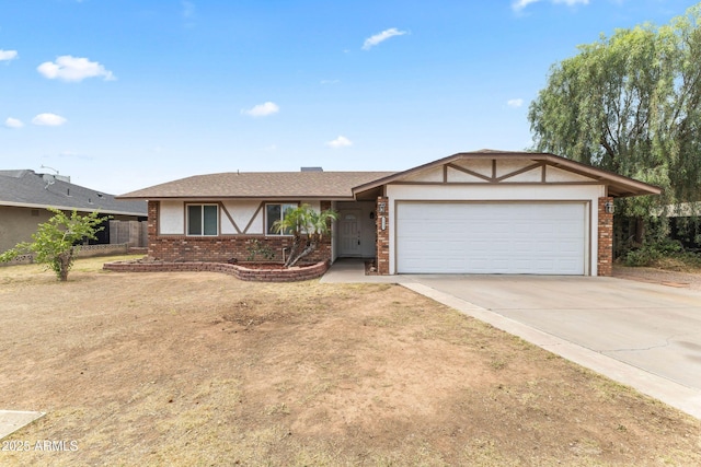 2633 E Garnet Ave, Mesa, AZ 85204 - view of front of house with a garage, brick siding, and concrete driveway