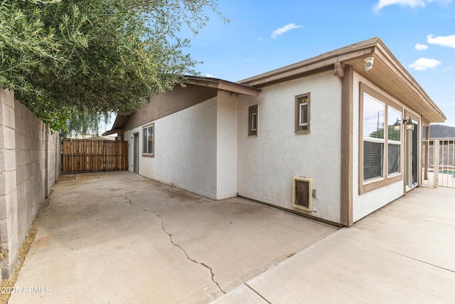 2633 E Garnet Ave, Mesa, AZ 85204 - view of side of property featuring a patio area and stucco siding