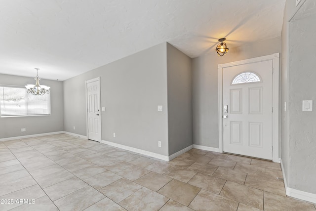 2633 E Garnet Ave, Mesa, AZ 85204 - entrance foyer featuring a chandelier, plenty of natural light, and baseboards