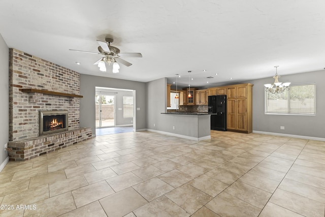 2633 E Garnet Ave, Mesa, AZ 85204 - unfurnished living room featuring a fireplace, a chandelier, a ceiling fan, baseboards, and light tile patterned floors