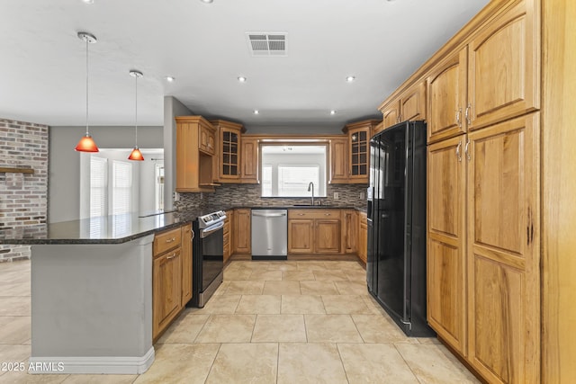 2633 E Garnet Ave, Mesa, AZ 85204 - kitchen featuring stainless steel appliances, a sink, plenty of natural light, and glass insert cabinets