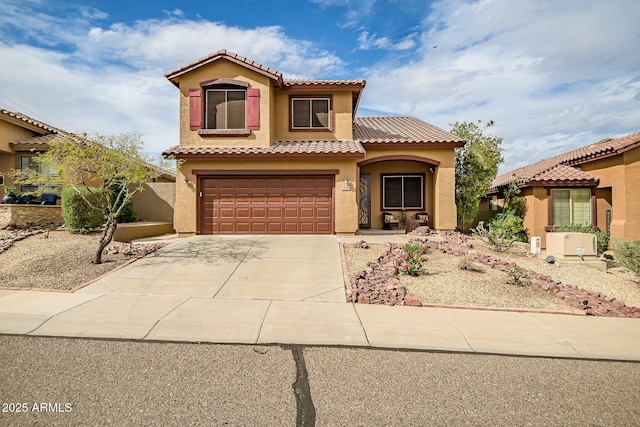 3948 W Rushmore Dr, Anthem, AZ 85086 - mediterranean / spanish home with a garage, a tile roof, concrete driveway, and stucco siding