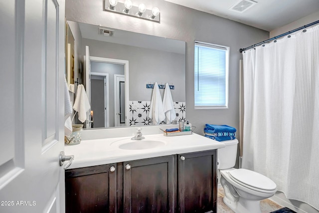 3948 W Rushmore Dr, Anthem, AZ 85086 - full bathroom with a shower with shower curtain, visible vents, toilet, and vanity