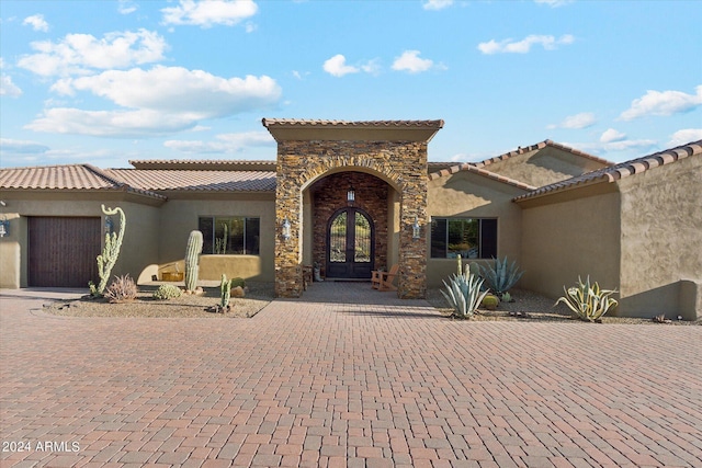 mediterranean / spanish-style house featuring a garage