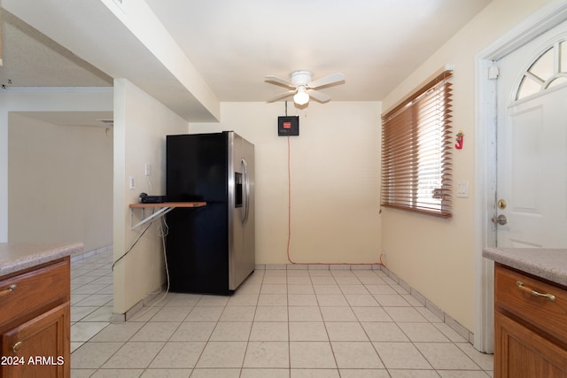 kitchen with ceiling fan, stainless steel fridge with ice dispenser, and light tile patterned floors