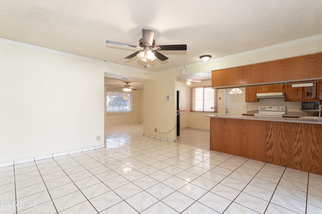 kitchen featuring kitchen peninsula, a textured ceiling, crown molding, electric stove, and light tile patterned flooring