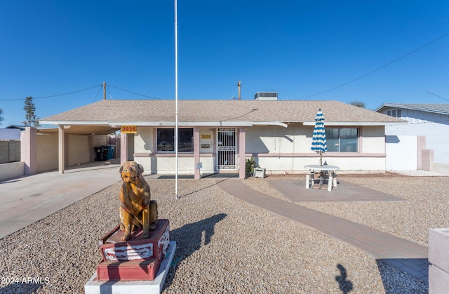 view of front of home with a carport