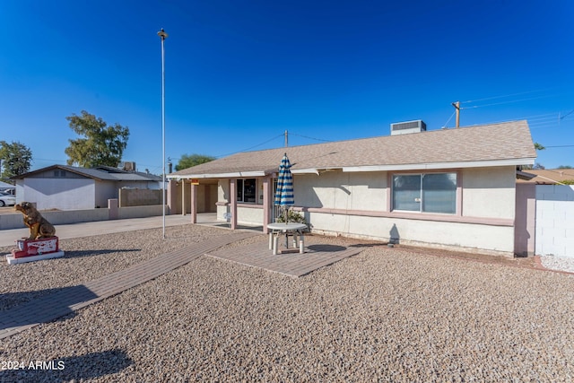 rear view of property featuring a patio